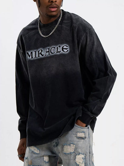 Model wearing oversized letter graphic long sleeve T-shirt styled casually