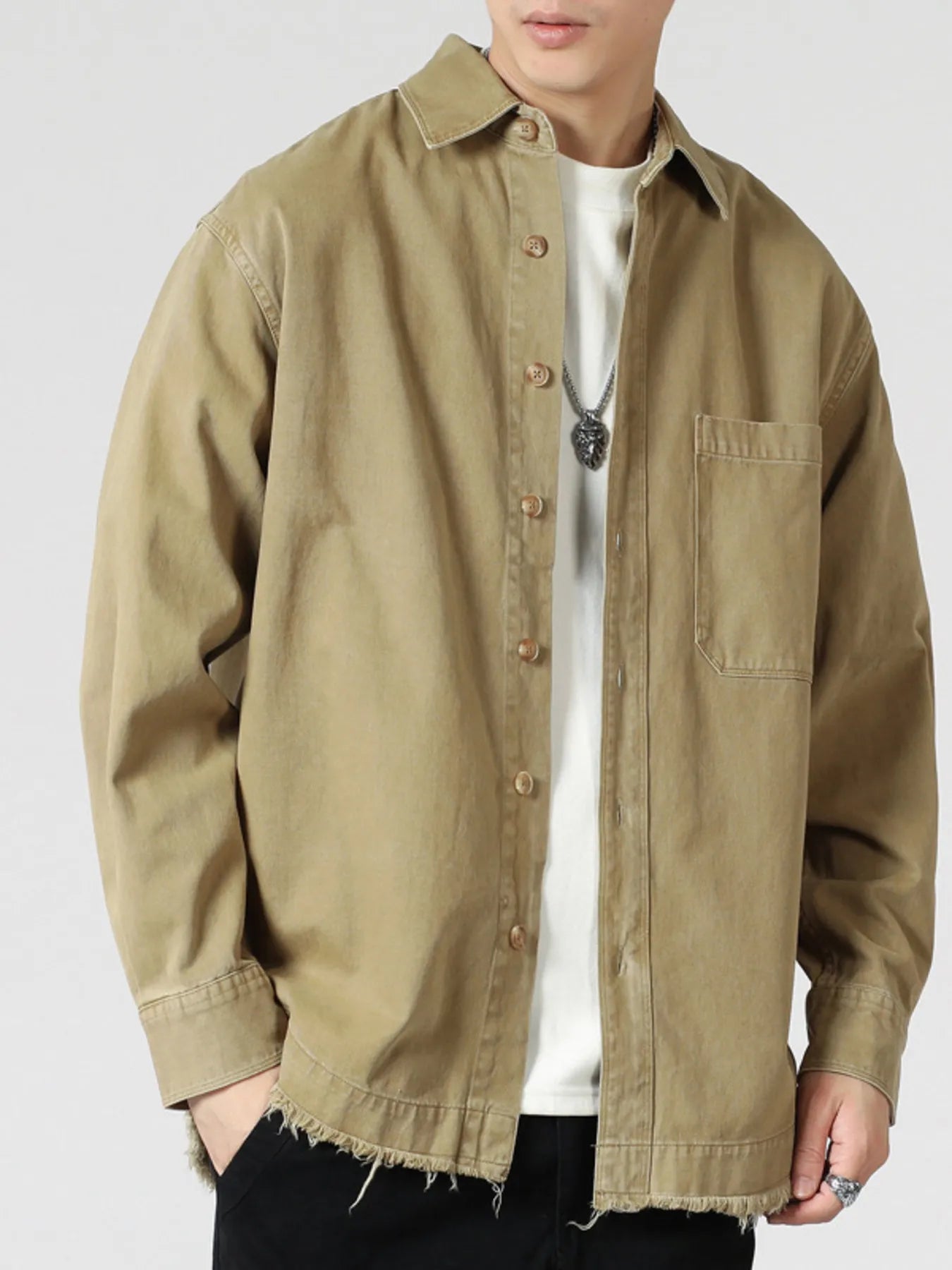 Model wearing relaxed oversized button-up long sleeve shirt styled casually