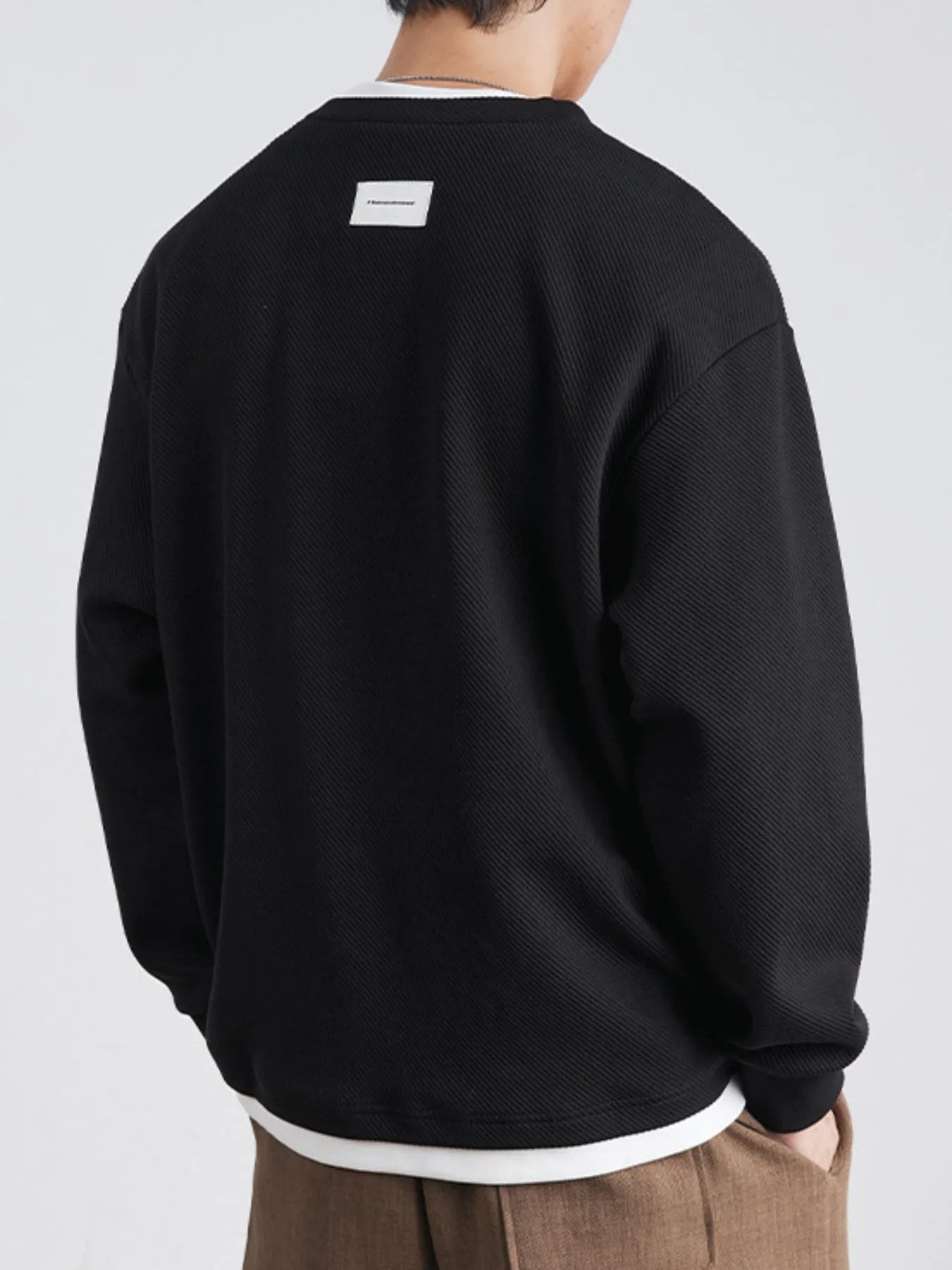Back view of oversized long sleeve sweatshirt