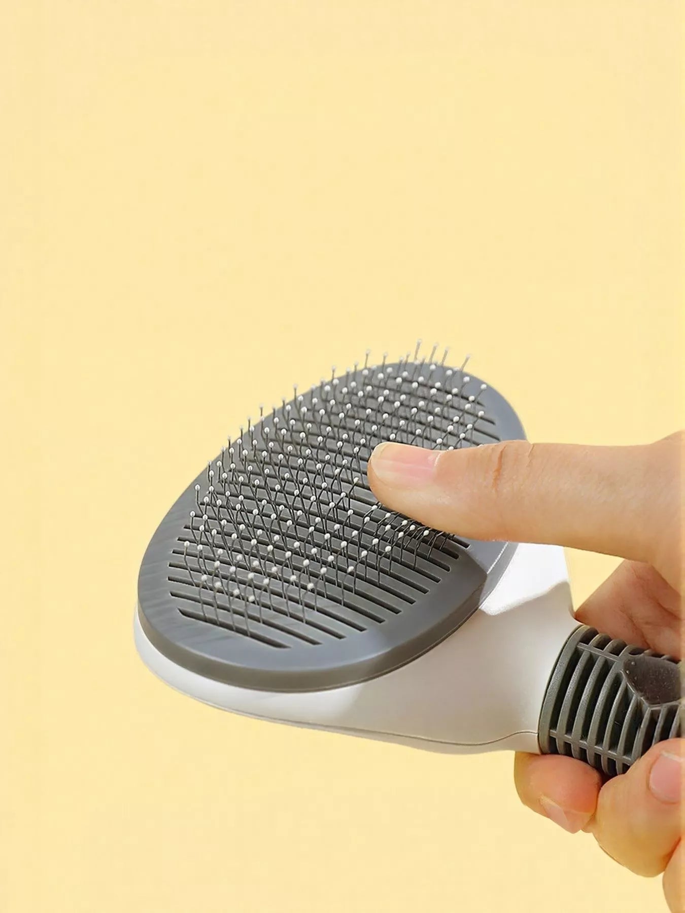 Front view of self-cleaning slicker pet hair removal brush