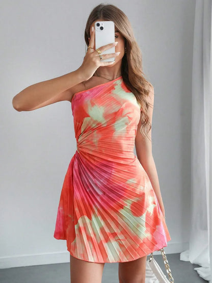 Model wearing cutout tie-dye dress styled for a modern resort event