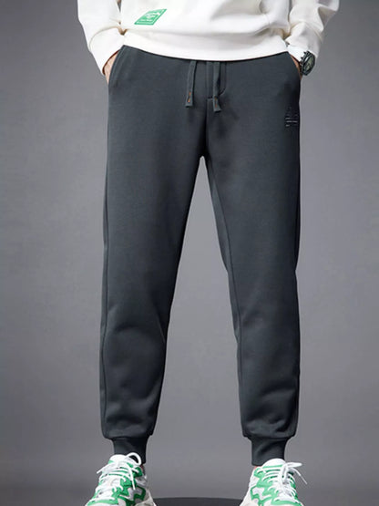 Close-up of pocket and drawstring detail on jogger pants