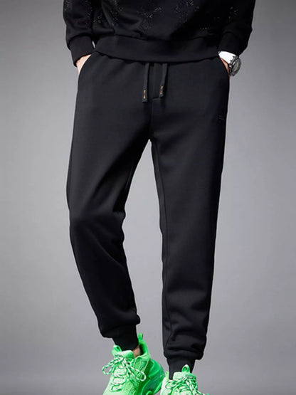 Front view of pocketed drawstring cotton blend jogger pants