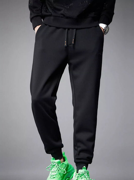 Front view of pocketed drawstring cotton blend jogger pants