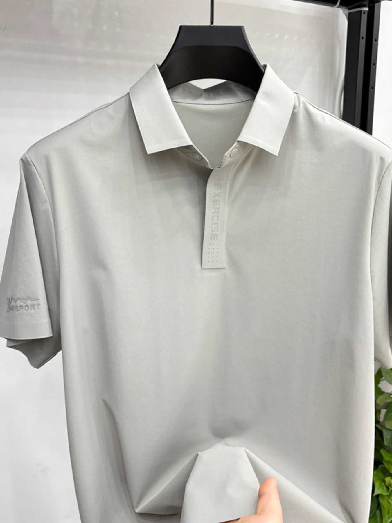 Front view of lightweight button short sleeve polo shirt