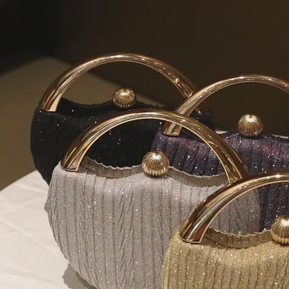 round clutch bag minimalist luxury design with chain strap in use