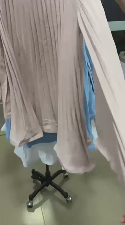 Video of model walking in pleated flare sleeve dress