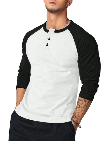 Close-up of contrast stitching and button detail on raglan sleeve T-shirt