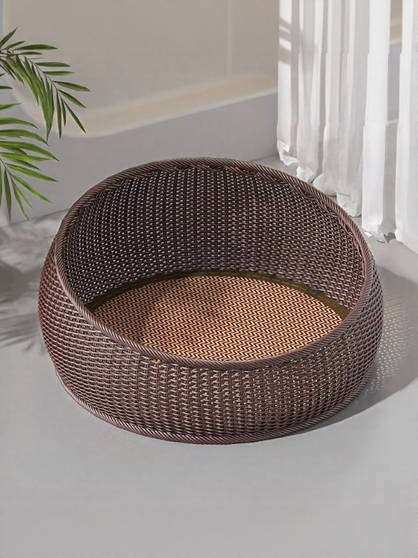 Cat resting inside woven rattan pet nest