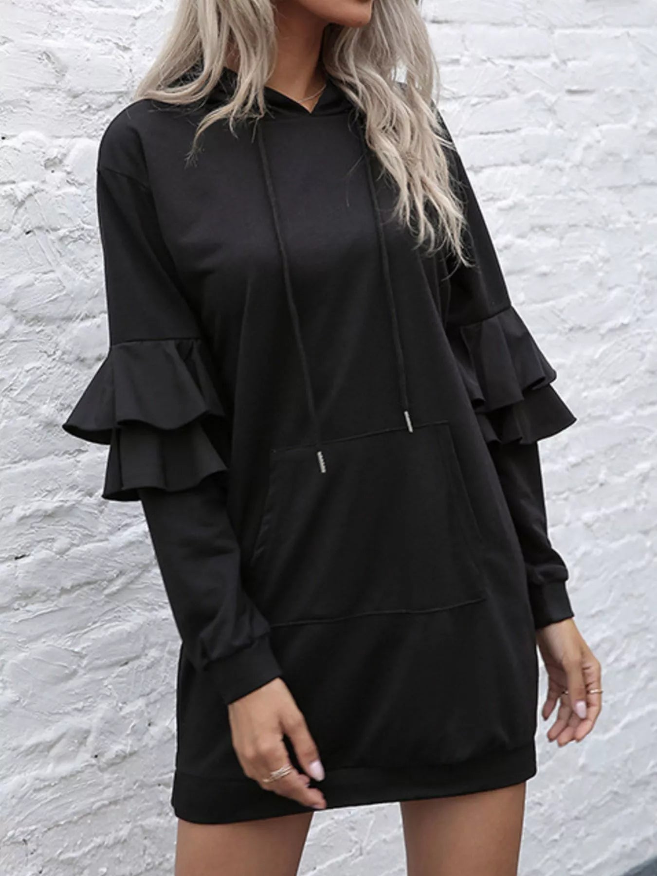 Close-up of the delicate ruffle trim and integrated side pocket construction