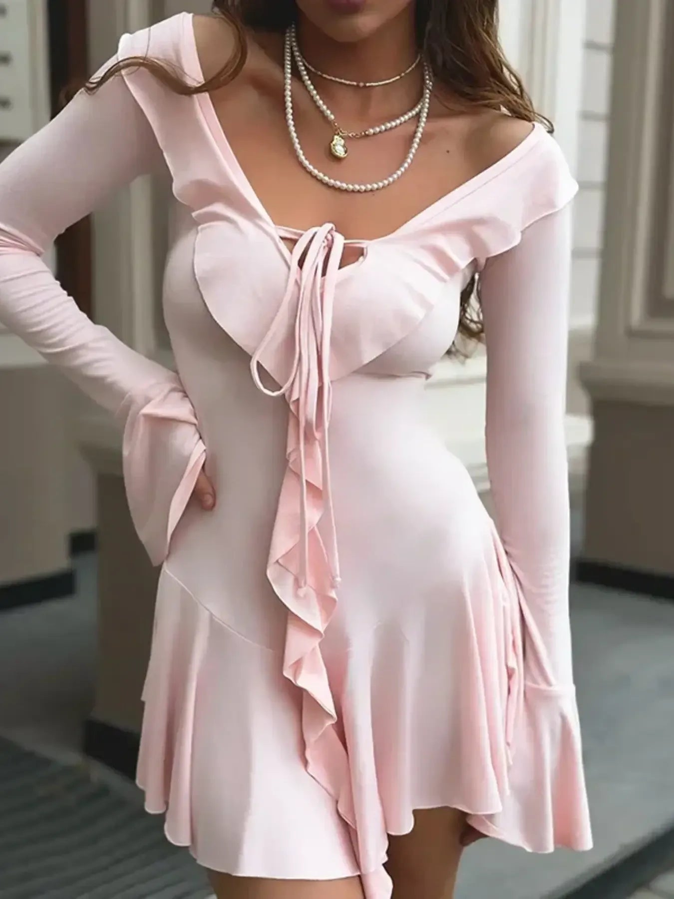 Close-up of the tiered ruffle hem and adjustable self-tie waistband