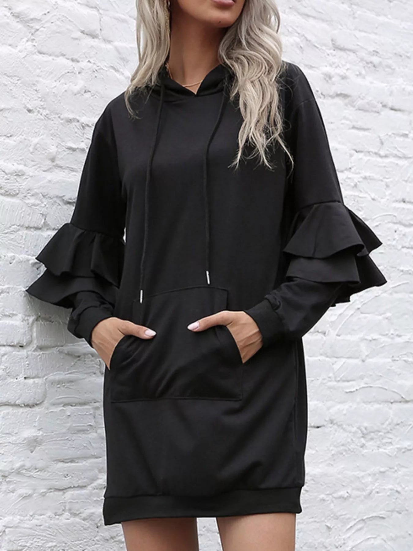 Front view of ruffled long sleeve hooded dress with adjustable drawstring waist