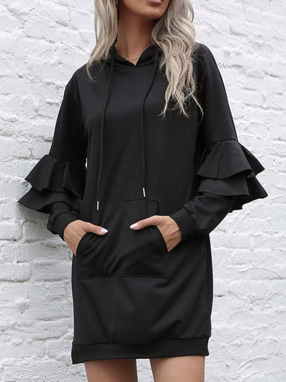 Front view of ruffled long sleeve hooded dress with adjustable drawstring waist