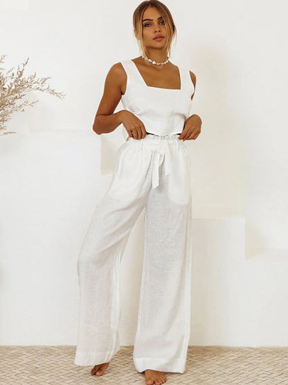 Model wearing the cotton two-piece set styled for a luxury resort look