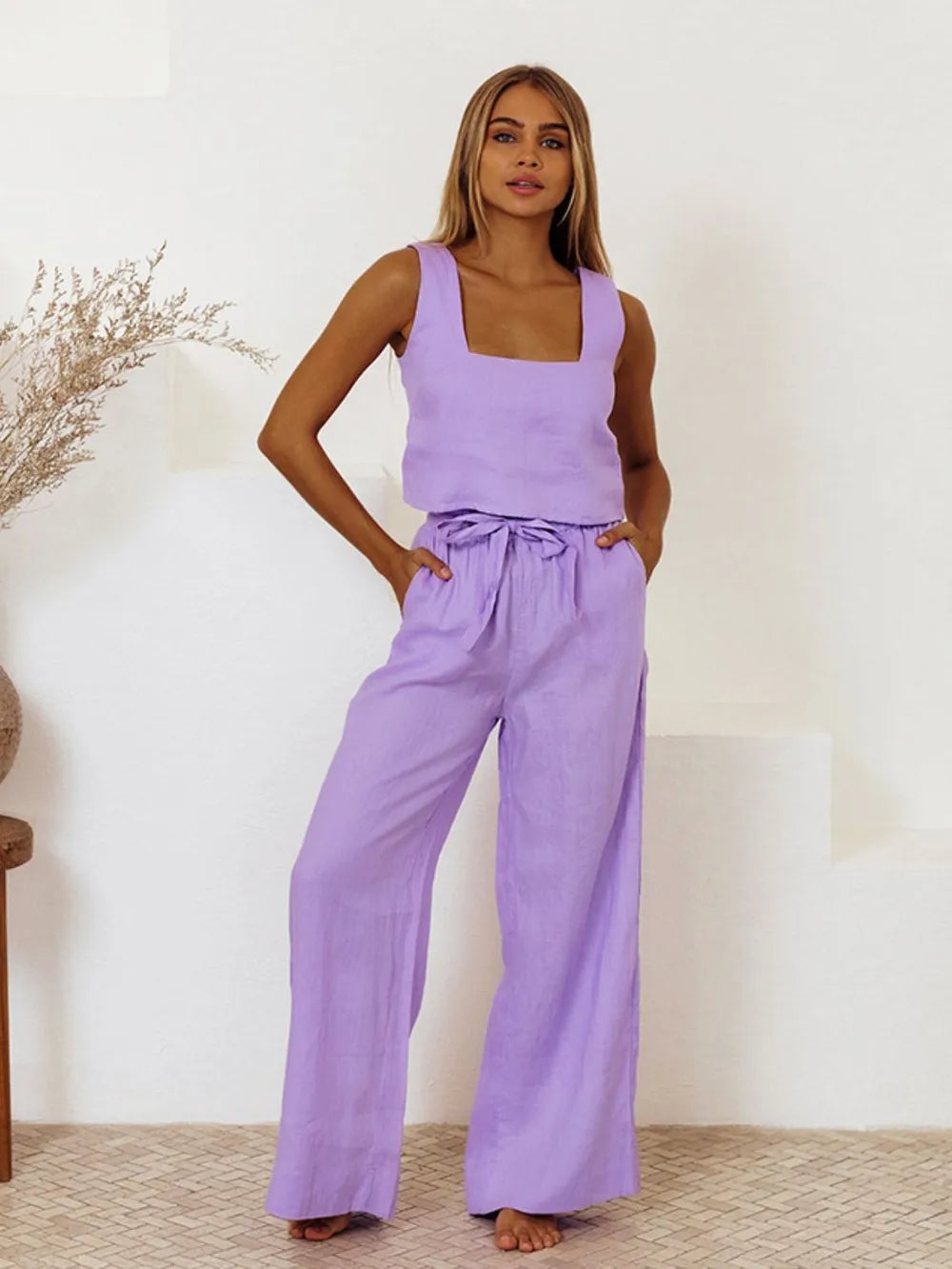 Close-up of the ruffled hem and adjustable waist tie construction