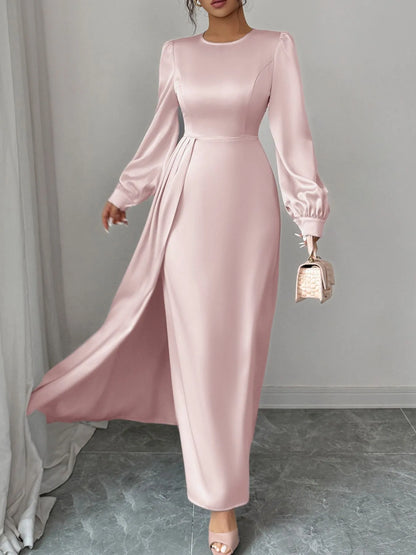 Model wearing satin long sleeve maxi dress styled for evening