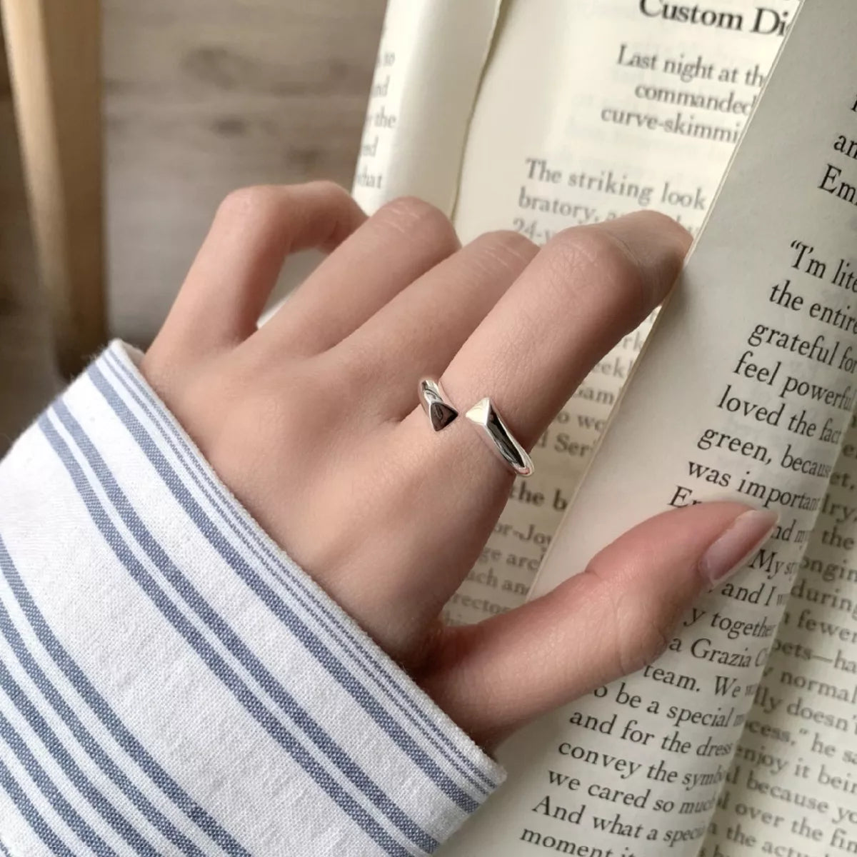Top view of the polished 925 sterling silver bypass ring showcasing the overlapping bands