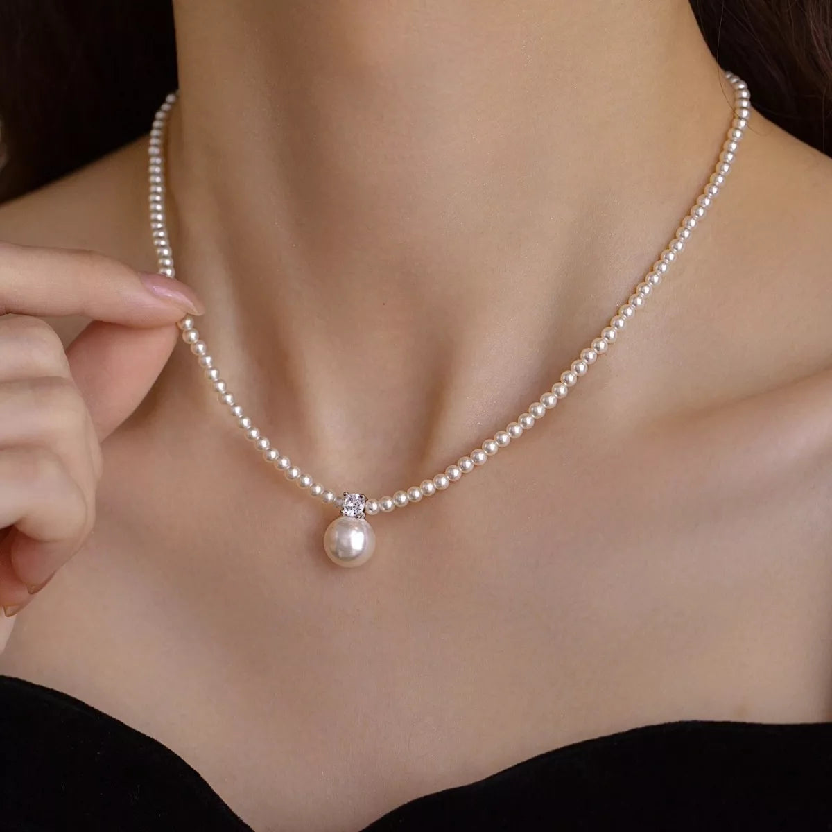 Front view of the 925 sterling silver necklace with a single luminous pearl pendant