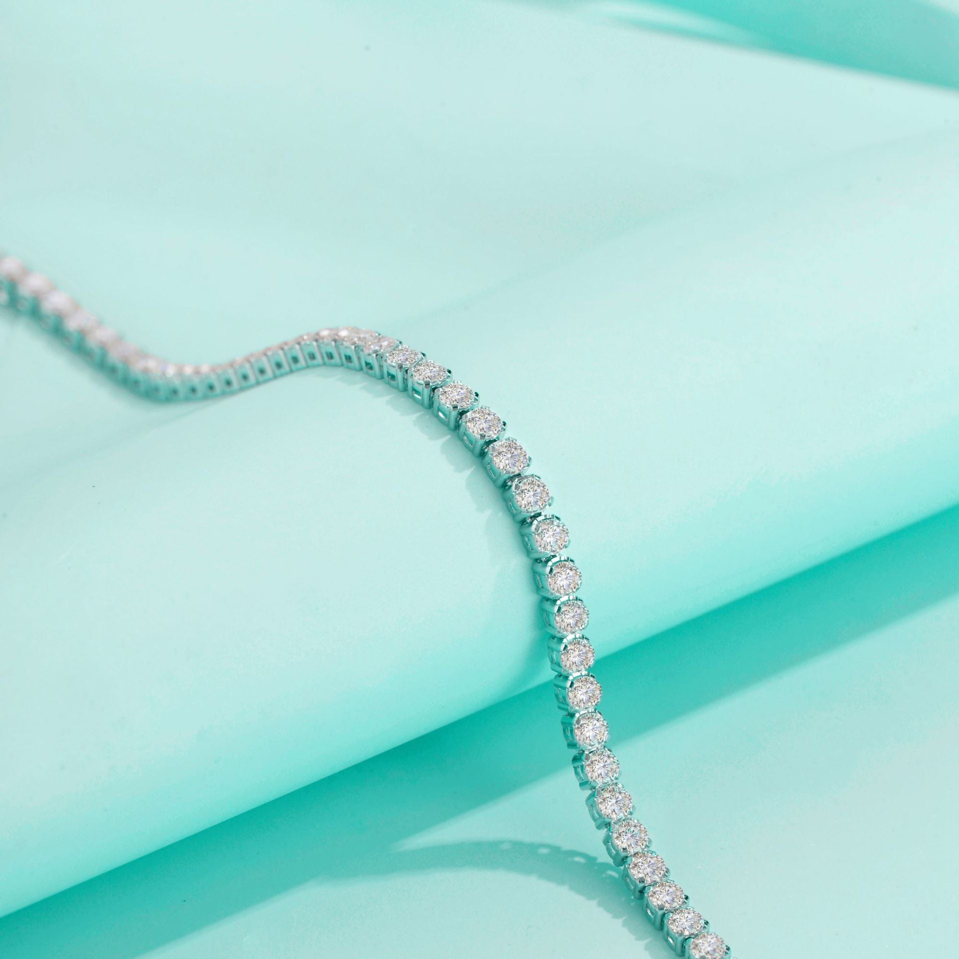 Model wearing the moissanite bracelet in a high-profile, sophisticated evening setting