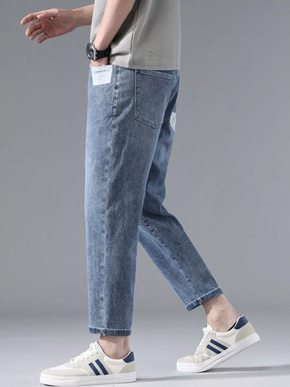 Close-up of washed denim texture on straight leg jeans