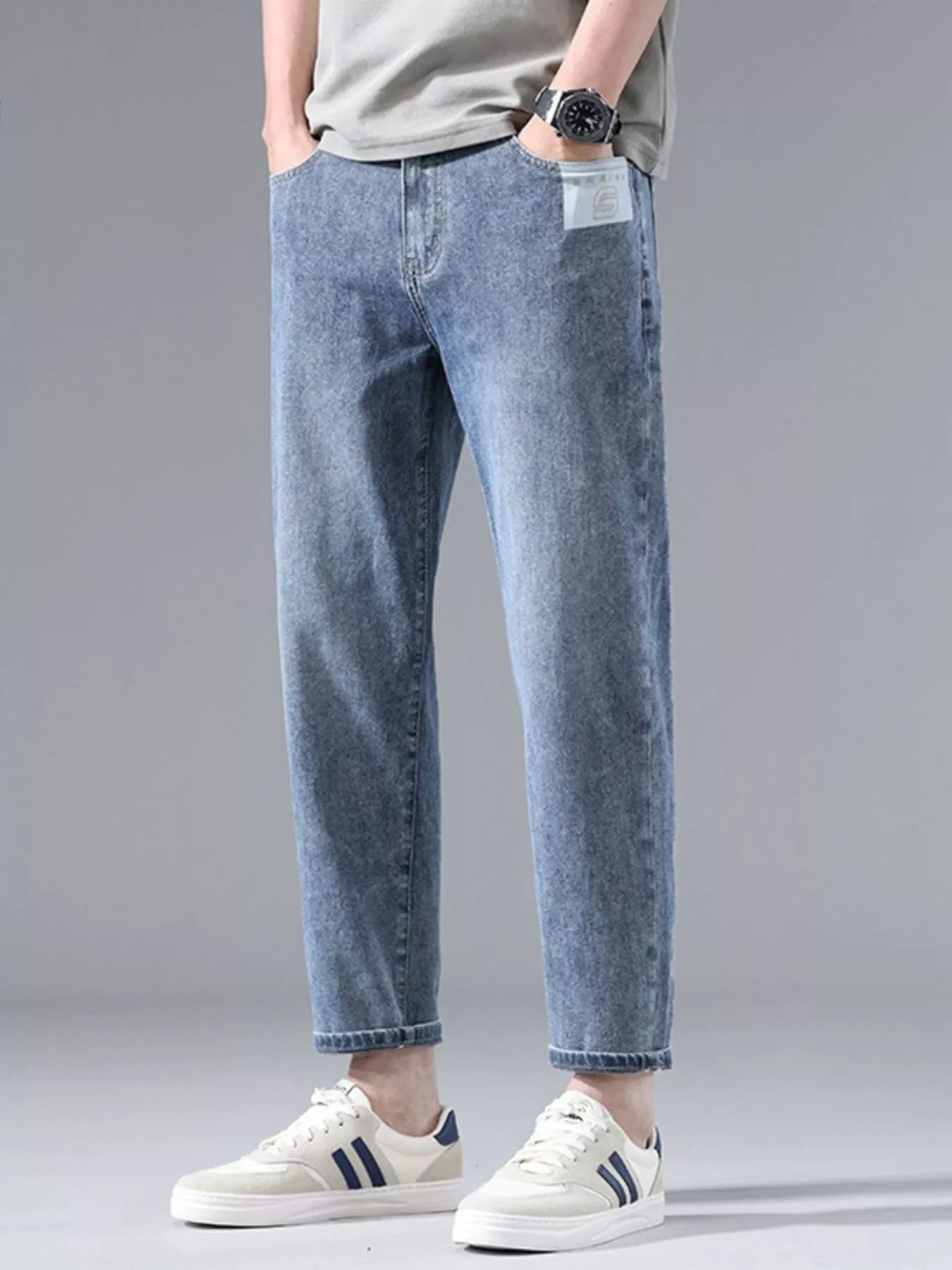 Front view of washed straight leg stretch denim jeans