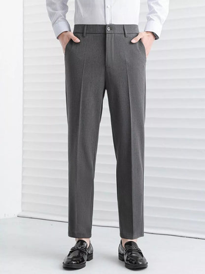 Model wearing straight leg tailored pants styled casually