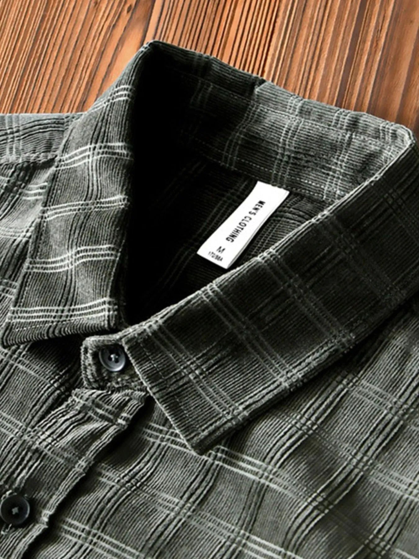Close-up of striped pattern and chest pocket on button-up shirt