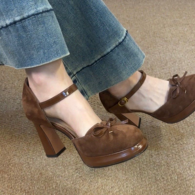 Close-up of the premium suede material and the architectural bow construction