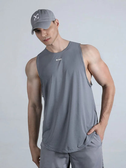 Model wearing plus size round neck tank top styled casually