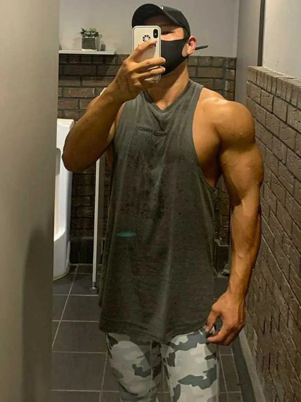 Model wearing round neck sleeveless tank top styled casually
