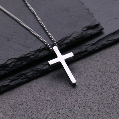 Front view of the high-polished titanium steel cross pendant on a box chain