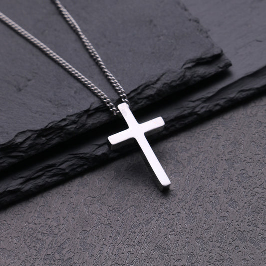 Front view of the high-polished titanium steel cross pendant on a box chain