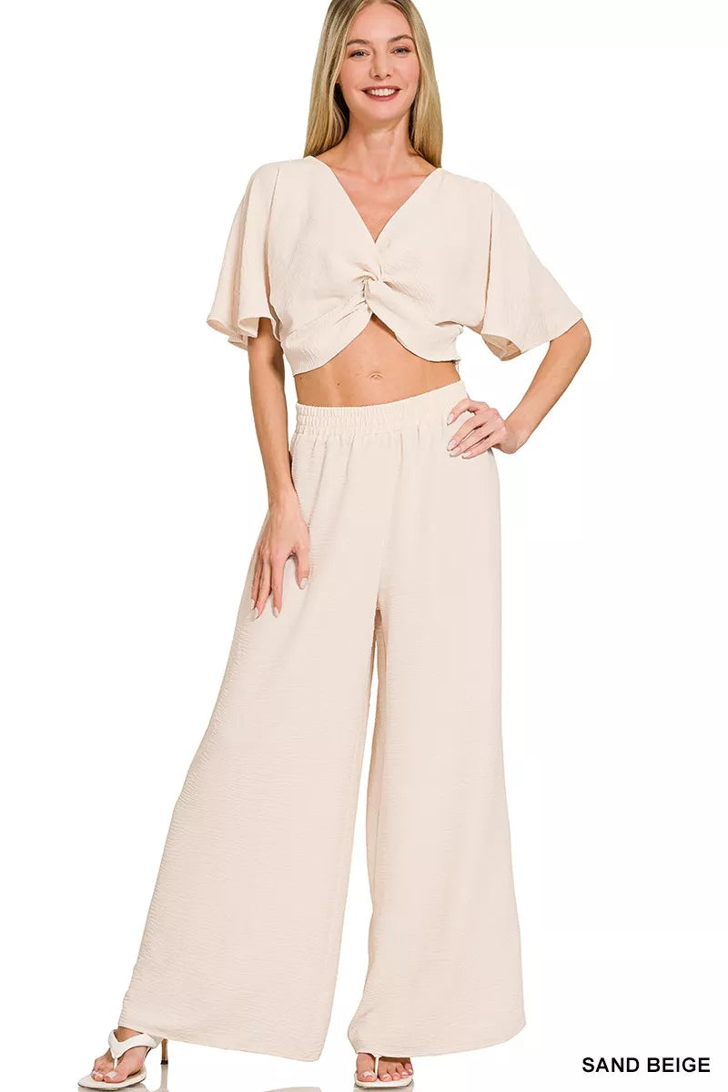 Front view of airflow twisted top and wide leg pants set