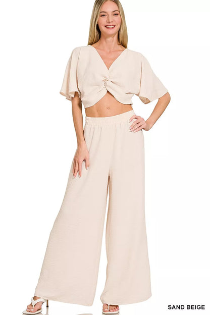 Front view of airflow twisted top and wide leg pants set