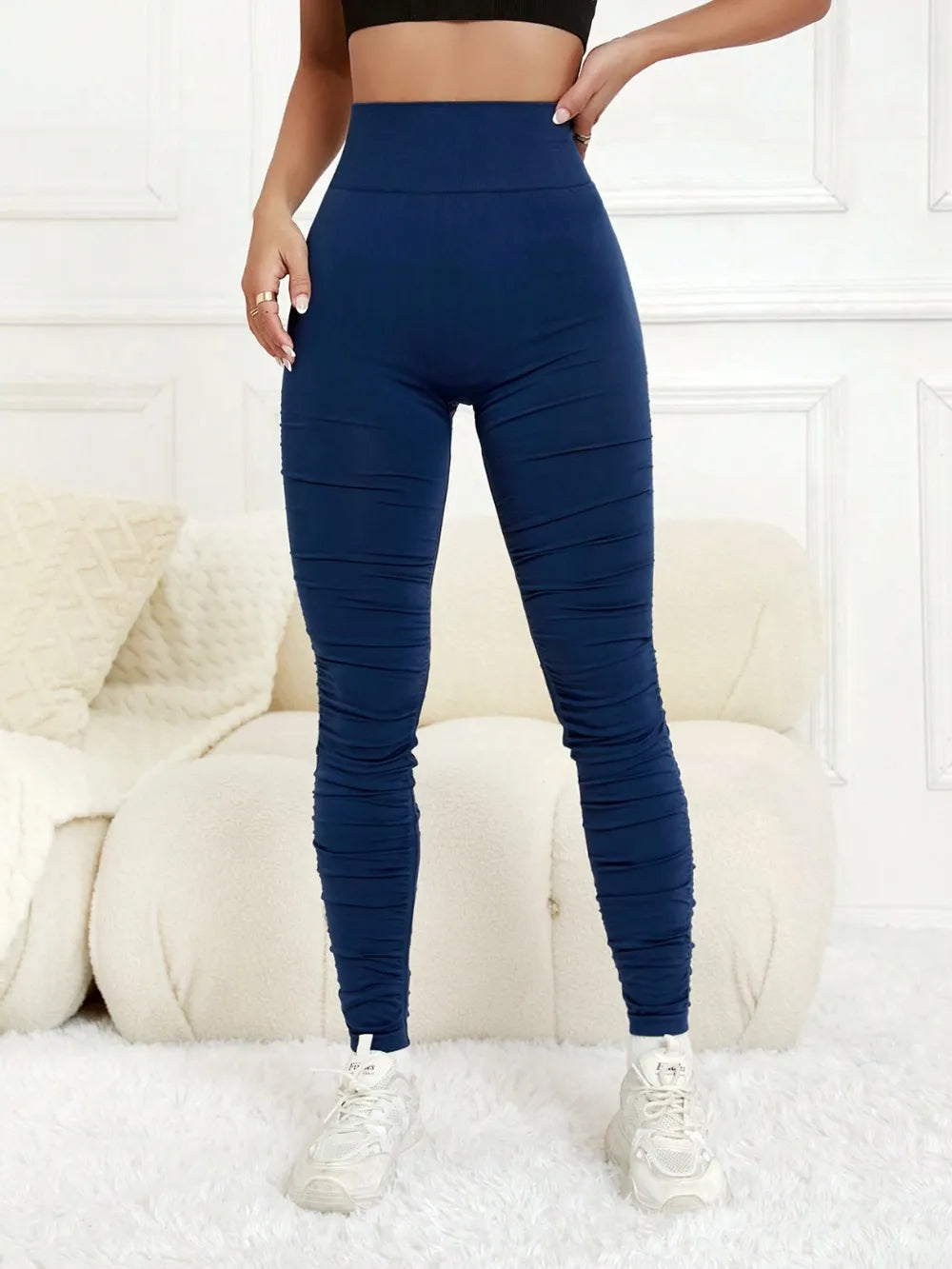 Close-up of the supportive high-waistband and dimensional ruching construction