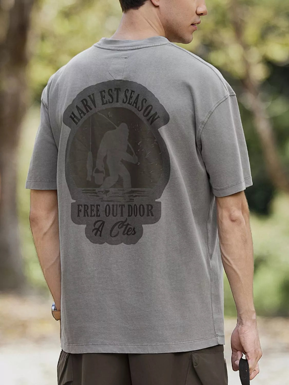 Model wearing washed graphic round neck cotton T-shirt styled casually