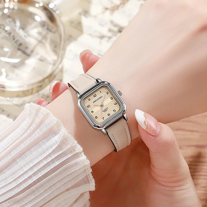 Close-up of the elegant steel strip band and the luminous finish of the square alloy case
