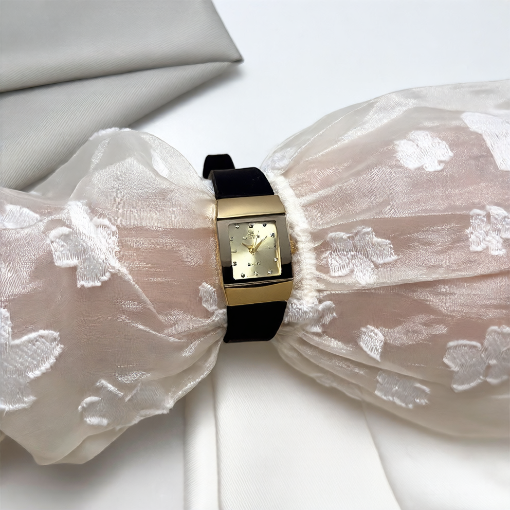 Close-up of the soft silicone strap and the polished stainless steel pin buckle