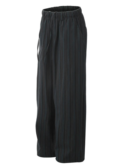 Model wearing wide leg cotton pants styled casually