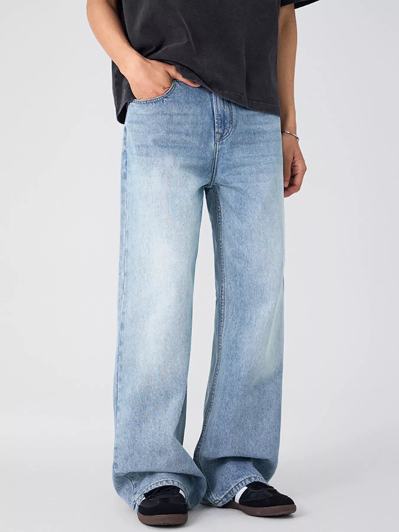 Model wearing oversized wide leg jeans styled casually