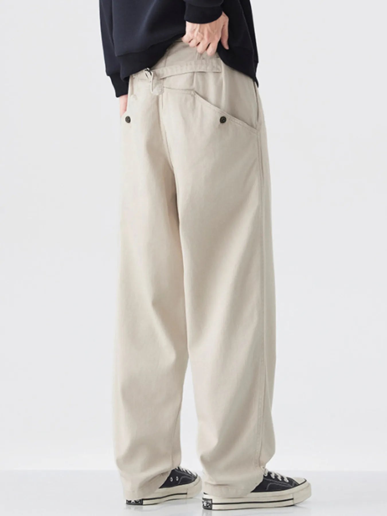 Close-up of pocket detail on cotton wide-leg pants