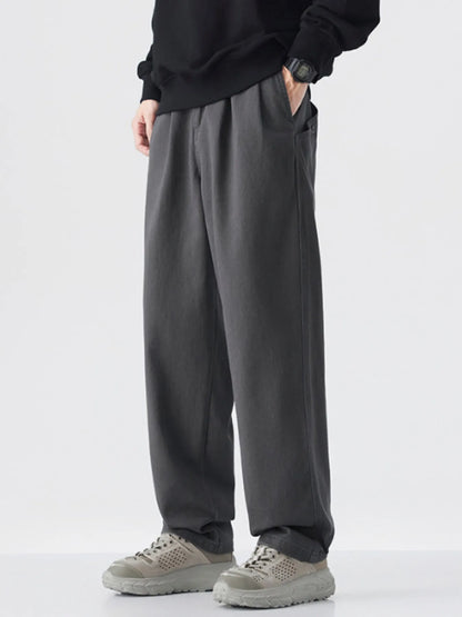 Model wearing wide-leg cotton pants styled casually