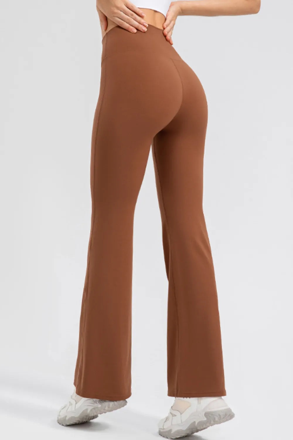 Close-up of the reinforced wide waistband and architectural bootcut hem